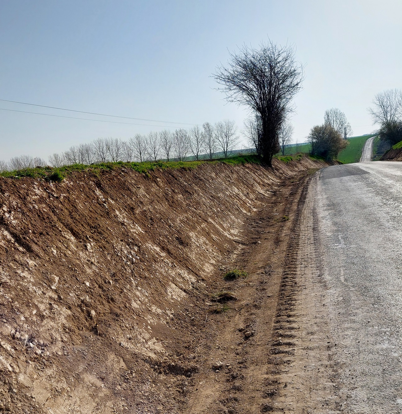 "Widening the road near Eaucourt l'Abbaye".  Thse locations can occasionally reveal a find! Taken by Bob Paterson June 2022